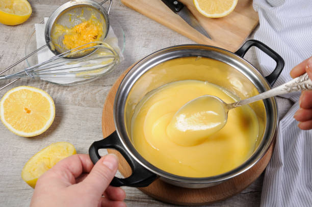 istock Freshly prepared lemon kurd - custard on fruit juice, in a saucepan whipped with whisk 1067061256