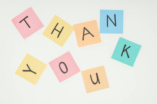 istock colorful sticky notes spelling thank you on lace with clothespins isolated on white background 1067061282