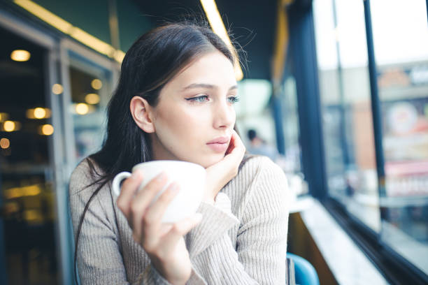 istock women who is enjoy in cafe 1067061348