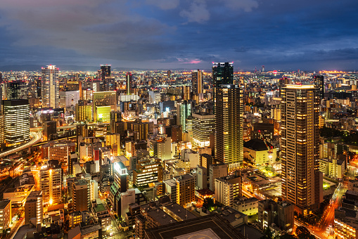 Beautiful illuminated Cityscape of Osaka at Night - Twilight. Aerial View. Osaka, Japan, Asia.