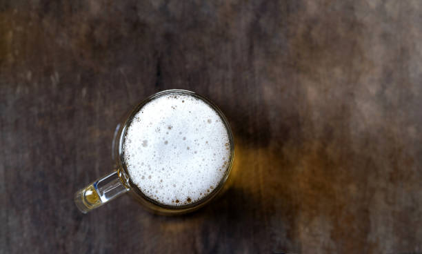 istock Beer in glass on the wooden table 1067064006