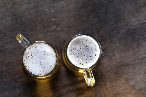 istock Beer in glass on the wooden table 1067064042