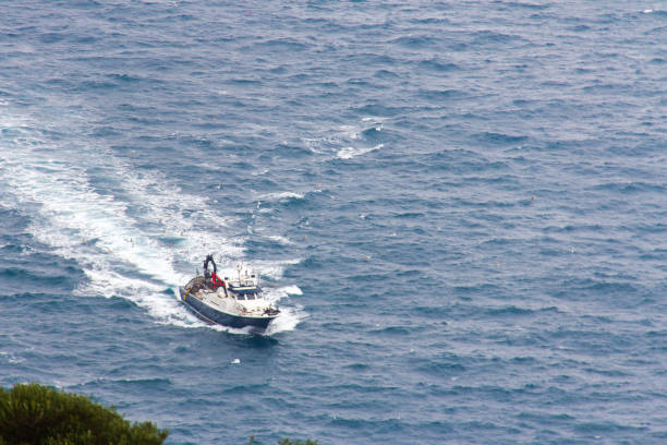 istock Fishing boat sailing in the mediterranean coast 1067064460