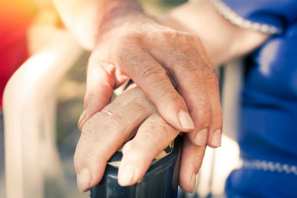 istock hands of older adults, senior couple 1067071066