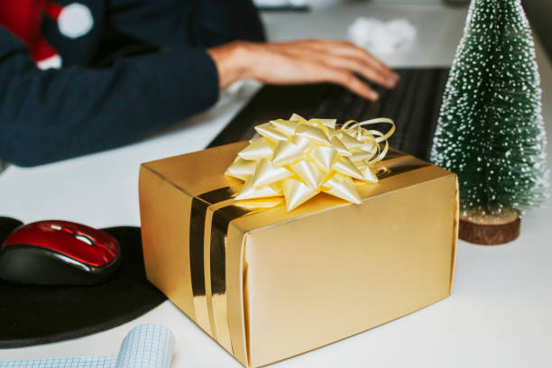istock christmas gift box with drawstring in the office 1067071190