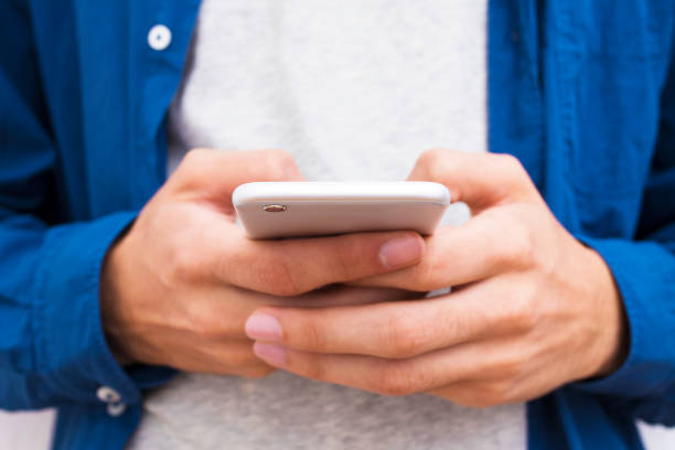 istock close-up of hands with mobile phone 1067071284