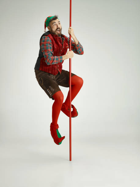 istock friendly man dressed like a funny gnome posing on an isolated gray background 1067071392