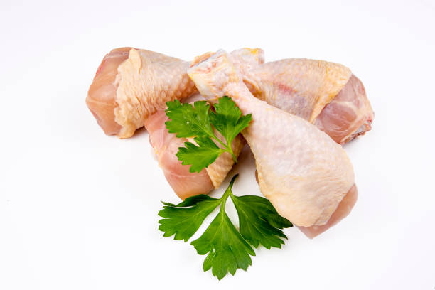 istock Raw chicken legs on the background isolated 1067071562