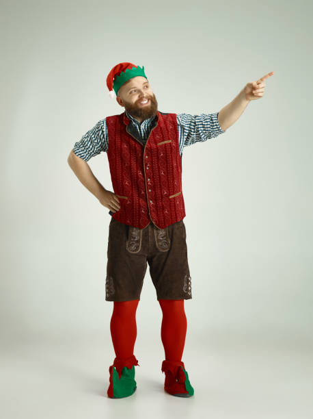 istock friendly man dressed like a funny gnome posing on an isolated gray background 1067071756
