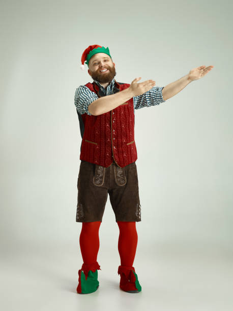 istock friendly man dressed like a funny gnome posing on an isolated gray background 1067071798