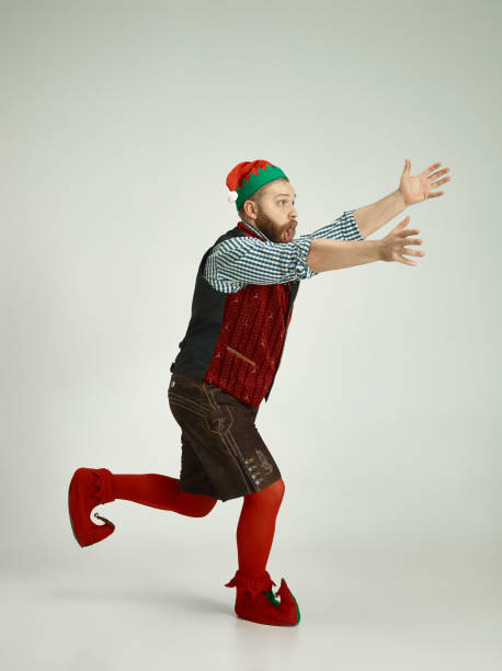 istock friendly man dressed like a funny gnome posing on an isolated gray background 1067071832