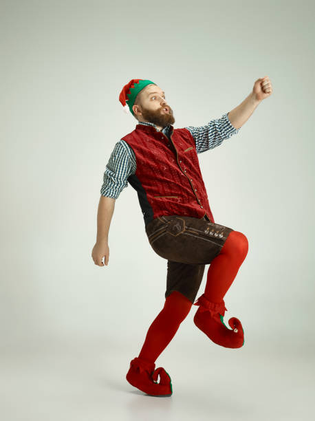 istock friendly man dressed like a funny gnome posing on an isolated gray background 1067071834