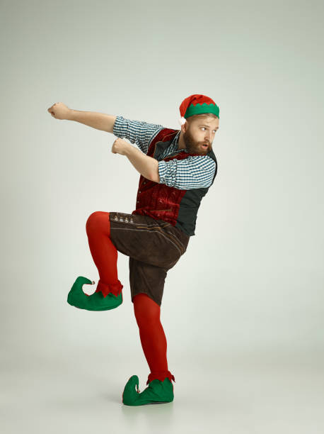 istock friendly man dressed like a funny gnome posing on an isolated gray background 1067071848