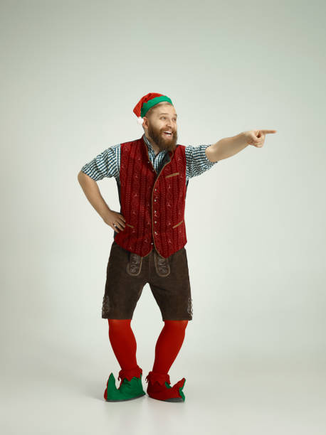 istock friendly man dressed like a funny gnome posing on an isolated gray background 1067071850