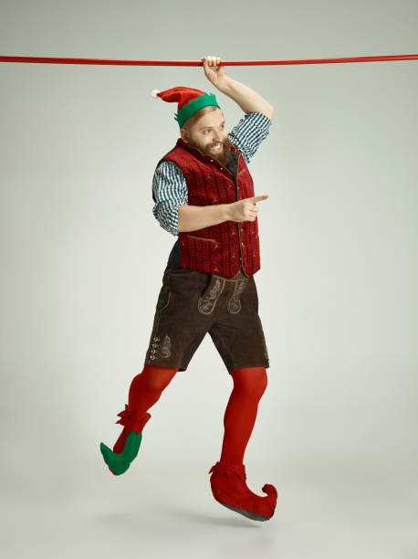 istock friendly man dressed like a funny gnome posing on an isolated gray background 1067071864