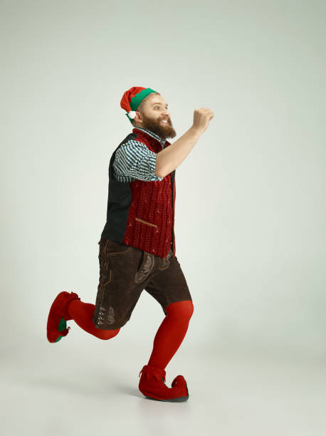 istock friendly man dressed like a funny gnome posing on an isolated gray background 1067071866