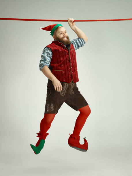 istock friendly man dressed like a funny gnome posing on an isolated gray background 1067071916