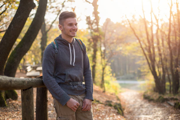 istock Young man hiking outdoor in the forest 1067075044