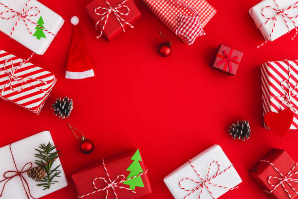 istock Christmas gifts and decorations on a red background. 1067087074