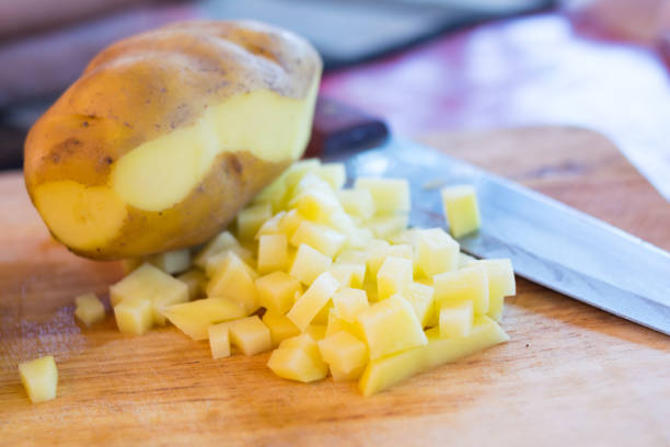 istock fresh potato slice on wooden board 1067087260