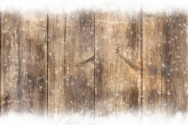 istock Brown wooden table, snowy winter background, texture 1067089350