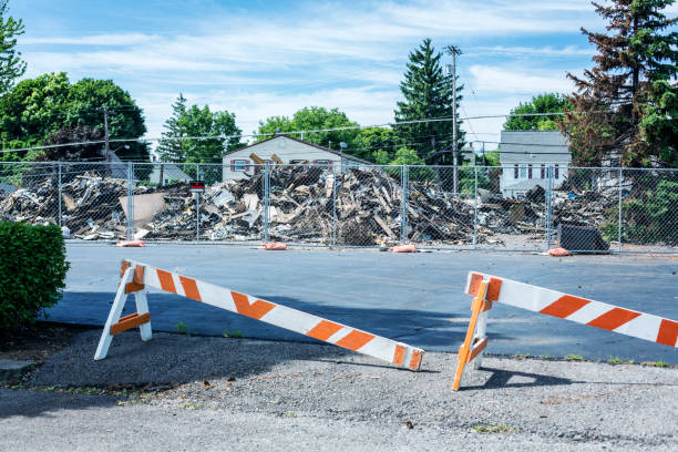Fire exit blocked with pallets and wood causing a hazard to people