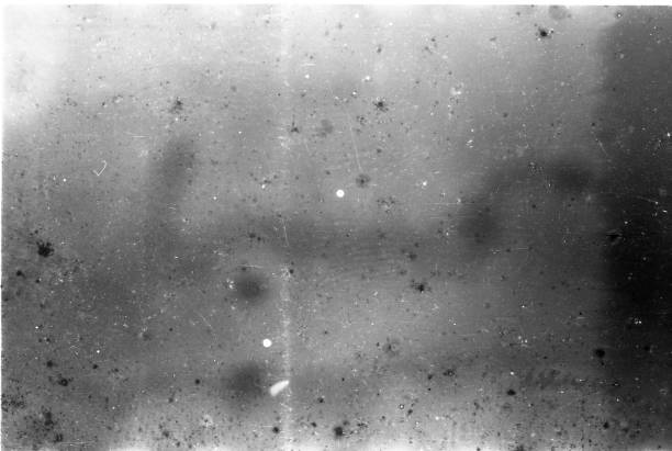 istock Old Scratched 35mm Film Strip Grunge Texture Background 1067089608