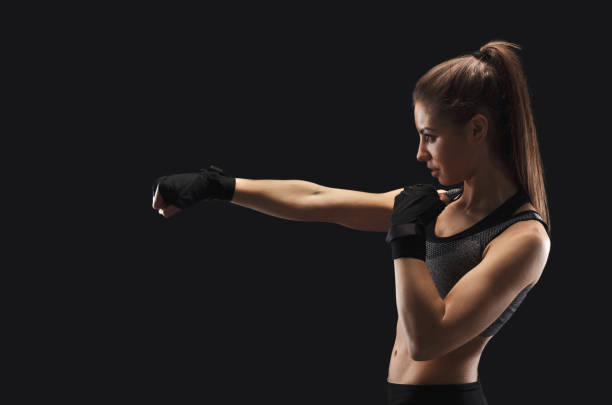 istock Gorgeous young woman with boxing bandage 1067093658