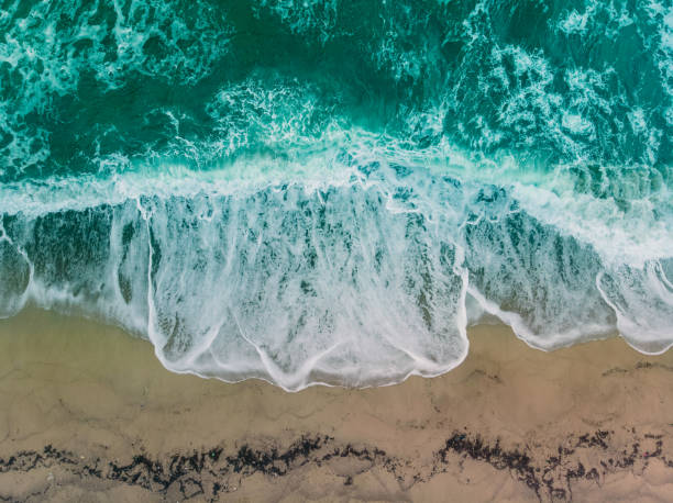 istock Aerial shot dirty coast wave 1067100392
