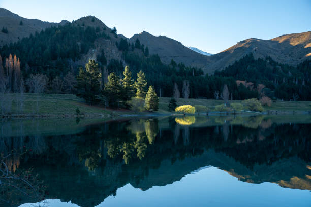 istock mountain peaks reflected in the National Park lake 1067104140