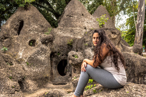 istock woman sitting on stones 1067104174