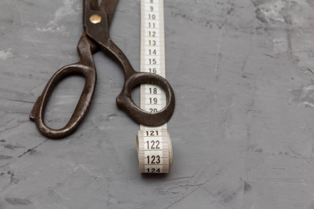 istock old big vintage scissors and a centimeter for measuring 1067109250