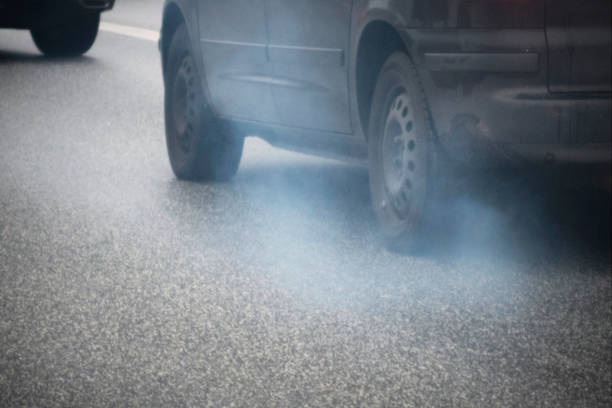 istock Smelly, smoking car in traffic 1067109280