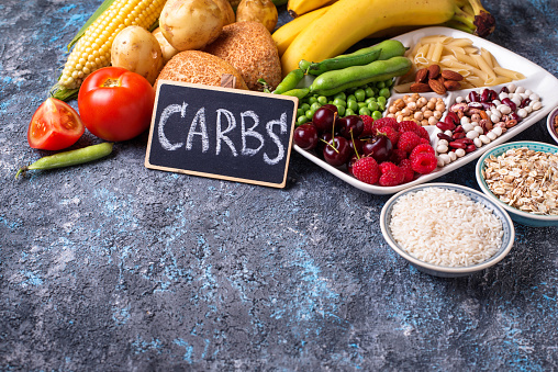 Food sources of carbohydrates. Cereals, beans, fruits, vegetables, berries, nuts and bread.