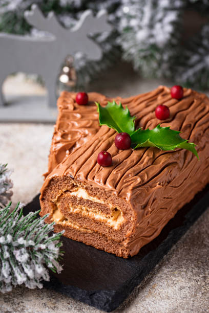 istock Christmas yule log cake. Traditional chocolate dessert 1067113922