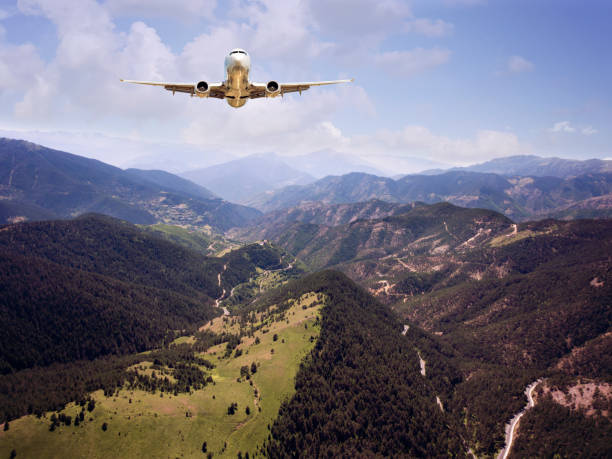 istock Passenger jet airplane flying above clouds 1067114012