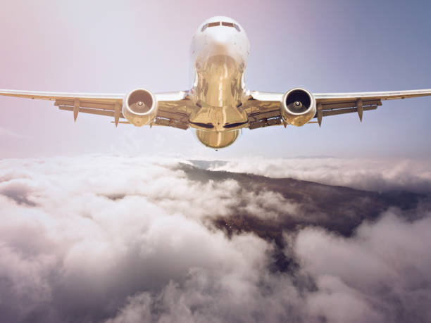 istock Passenger jet airplane flying above clouds 1067115608