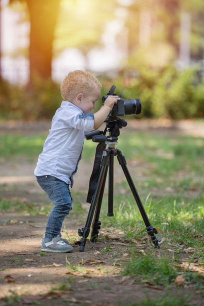 istock A two years old boy is photographer. 1067116632