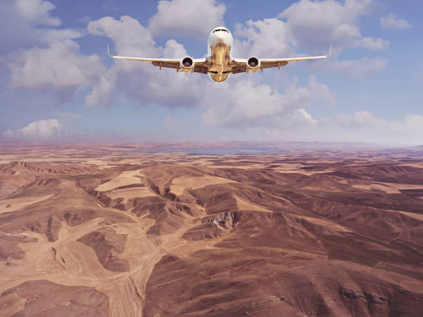 istock Passenger jet airplane flying above clouds 1067117538