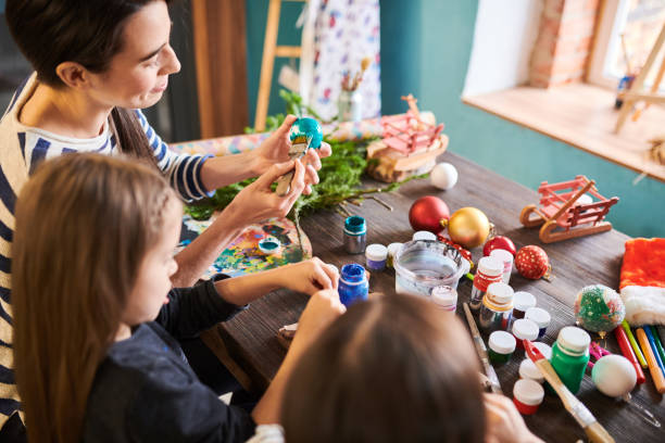 istock Painting Christmas Ornaments in Art Class 1067120122