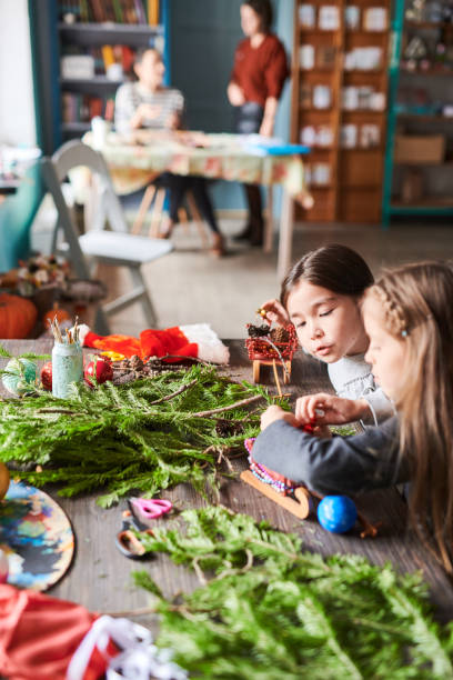 istock Little Girls Making Christmas Presents 1067120206