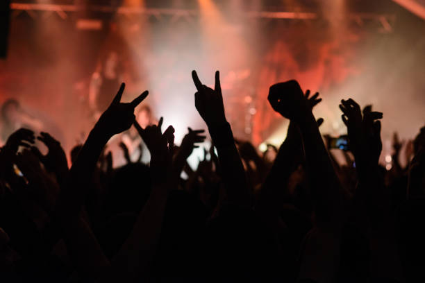 istock Hand raised showing a heavy metal rock sign 1067123978