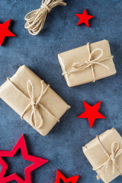 istock Some christmas presents in decorative boxes on a dark background 1067126062