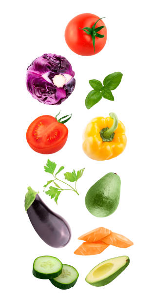 istock Fresh flying vegetables ingredients isolated on a white background. 1067126624