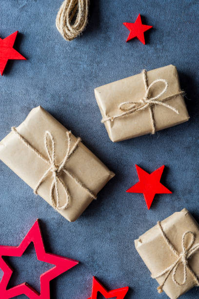 istock Some christmas presents in decorative boxes on a dark background 1067126844