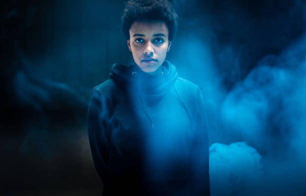 portrait of a young woman with a blue smoke bomb - 2042 imagens e fotografias de stock