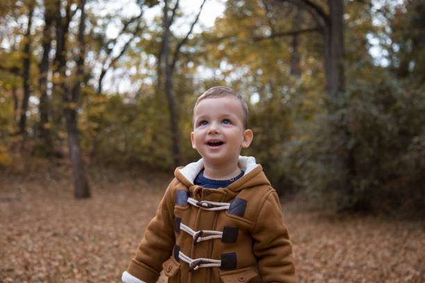 istock Young happy family having fun in public park 1067127004