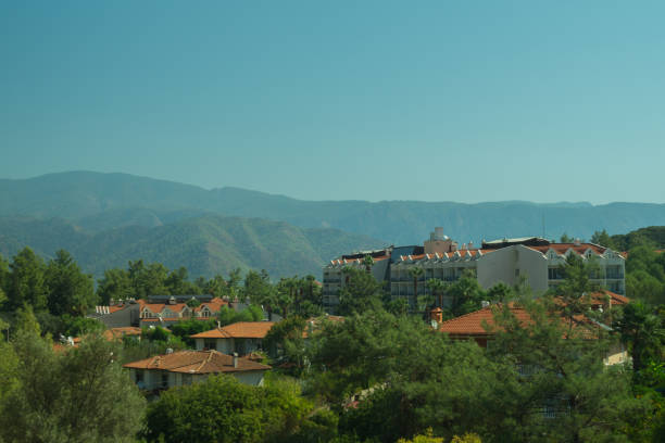 istock Mountain town panoramic view. city between the hills 1067130396