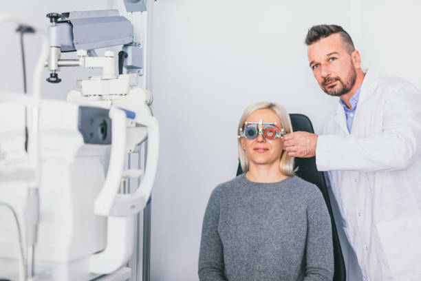 istock Doctor checking his patients eyesight 1067130414