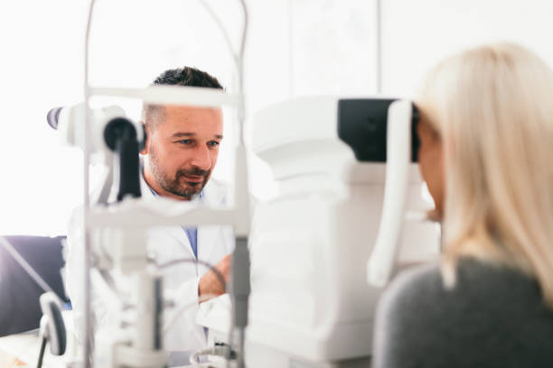 istock Optician examining his patient's eyes 1067130476